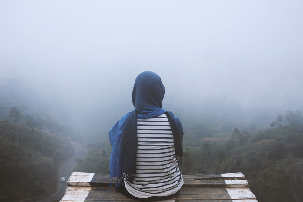 A silhouette emerging from fog — looking toward an uncertain future